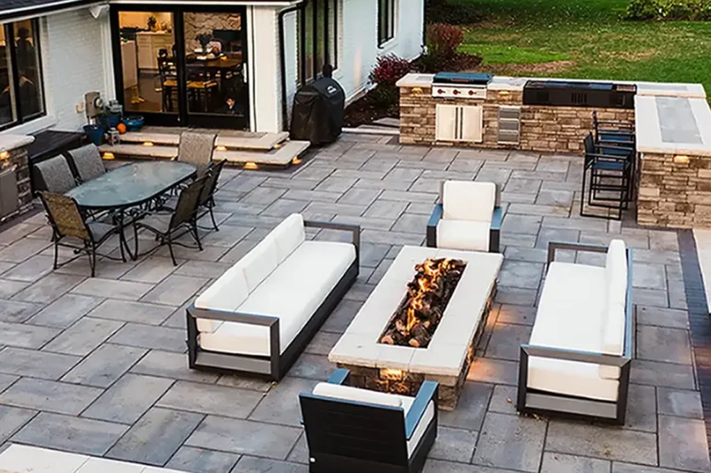 Commercial hardscaping contractor designing outdoor patio and entertainment spaces in Wellesley MA.
