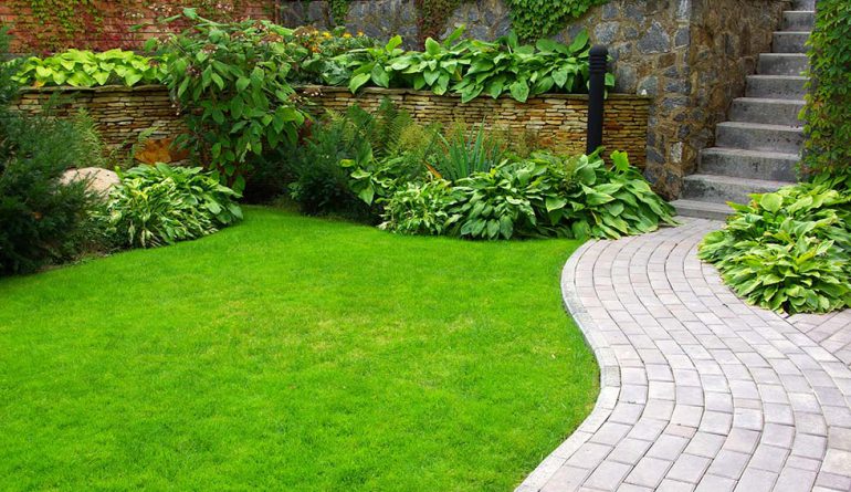 Commercial landscaping and hardscape walkway installation for professionally maintained properties in Newton.